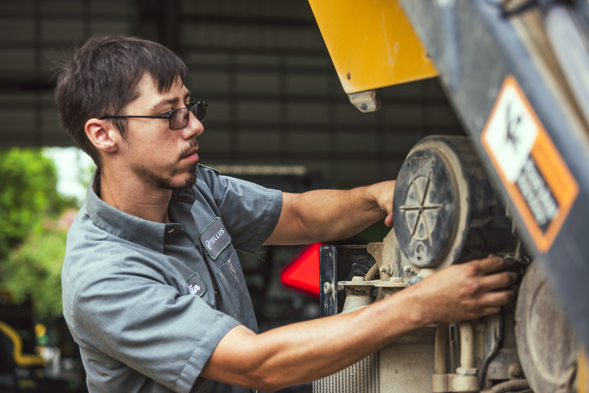 A technician works on a machine in the field.
