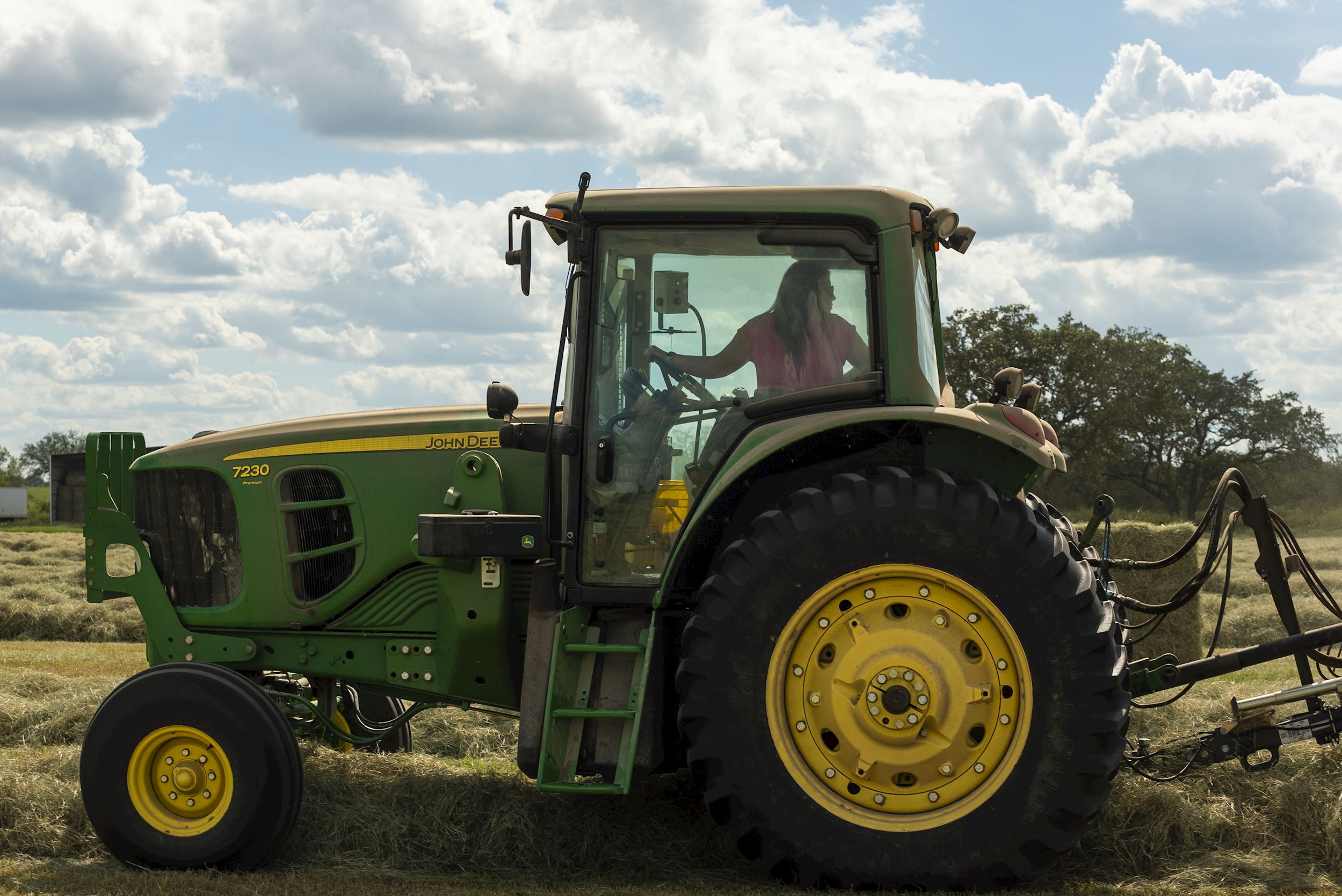 A used John Deere 7230 tractor is used on a farm in Texas.