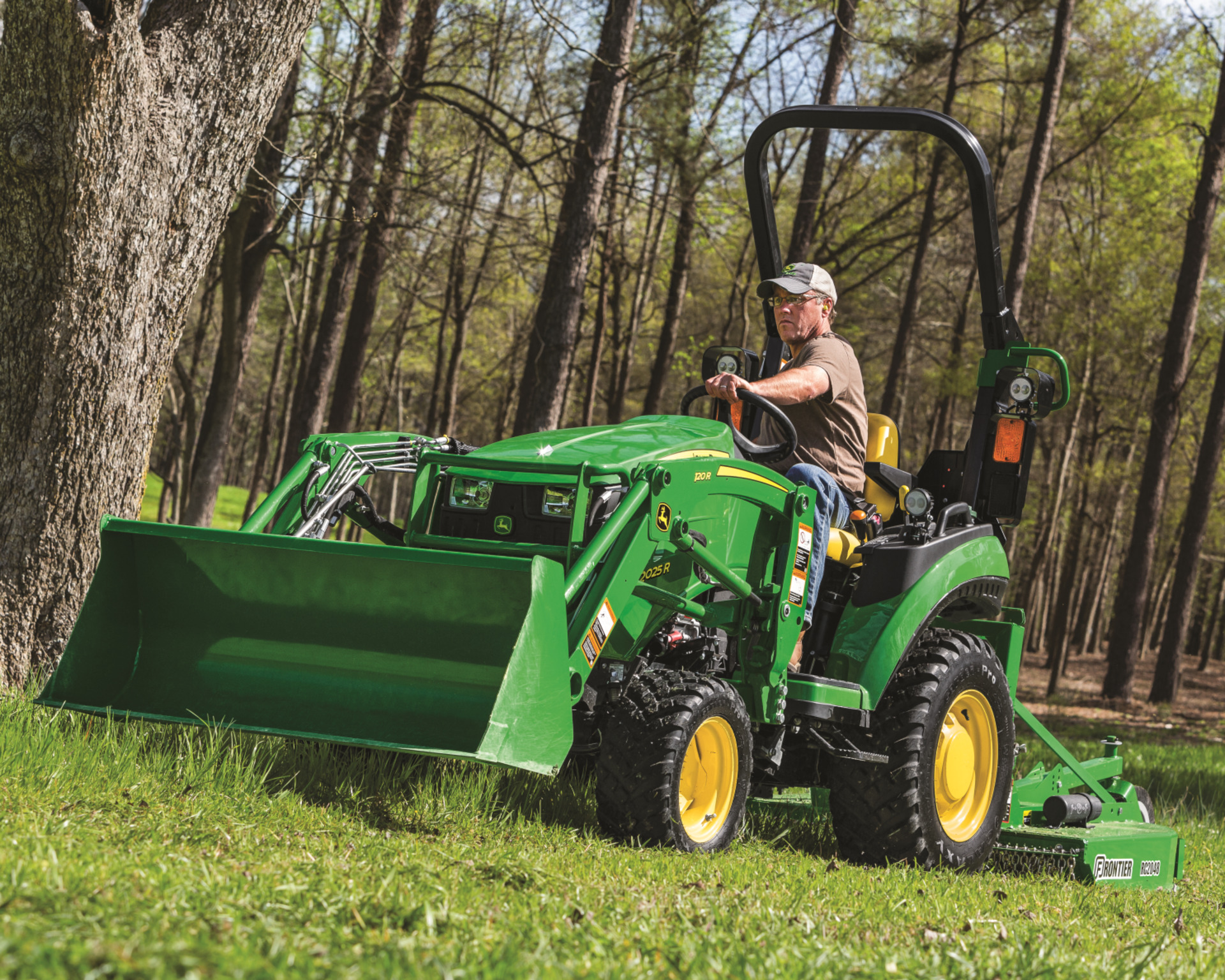A man operates a tractor on a Texas ranch.