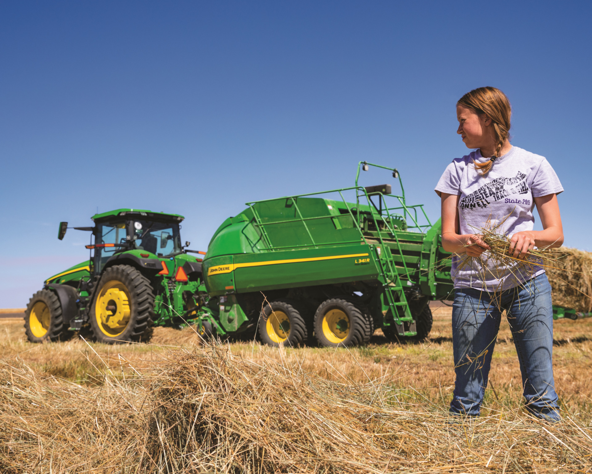 A large square baler on a farm in Texas.