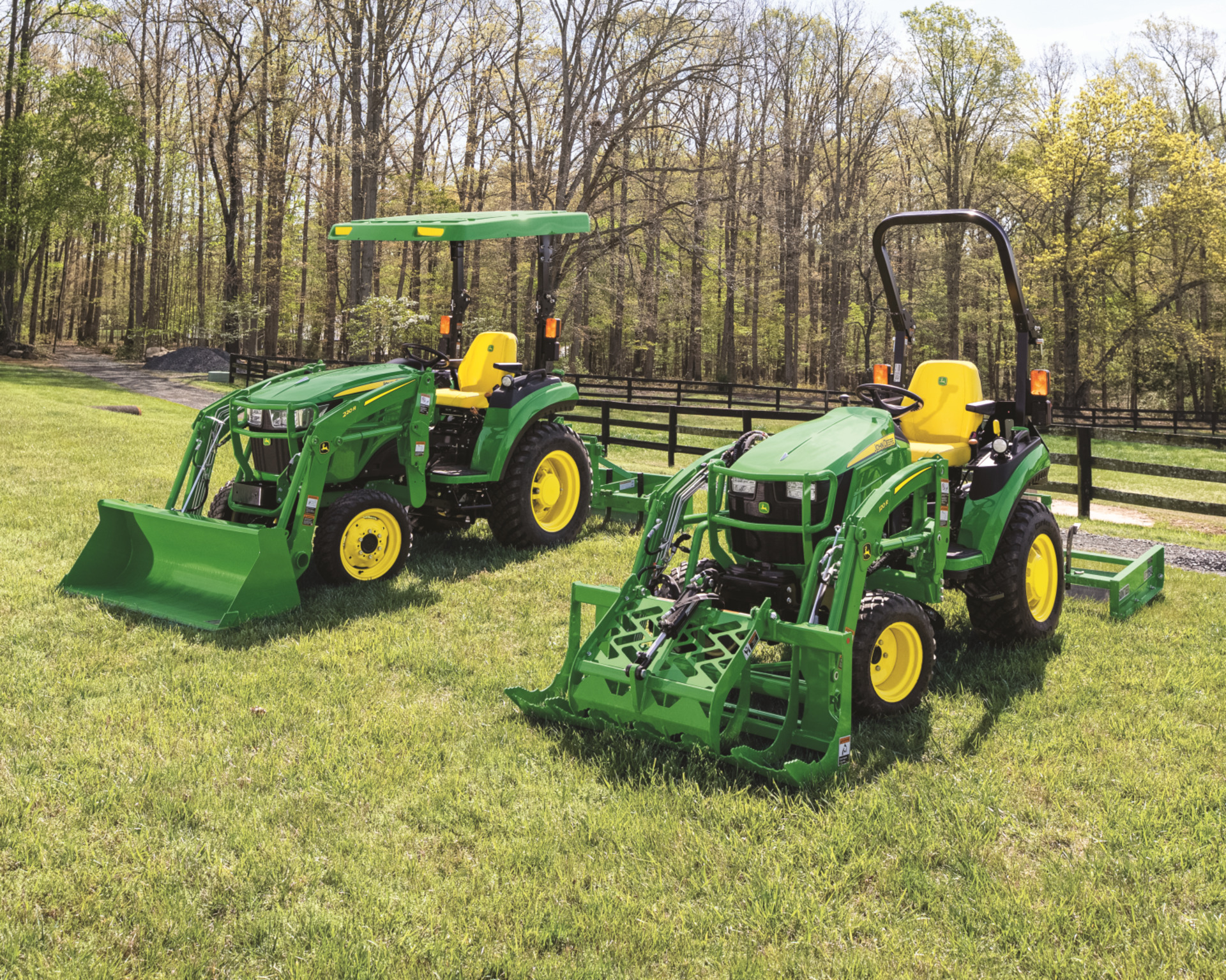 Two used compact utility tractors sit in a field in Texas.