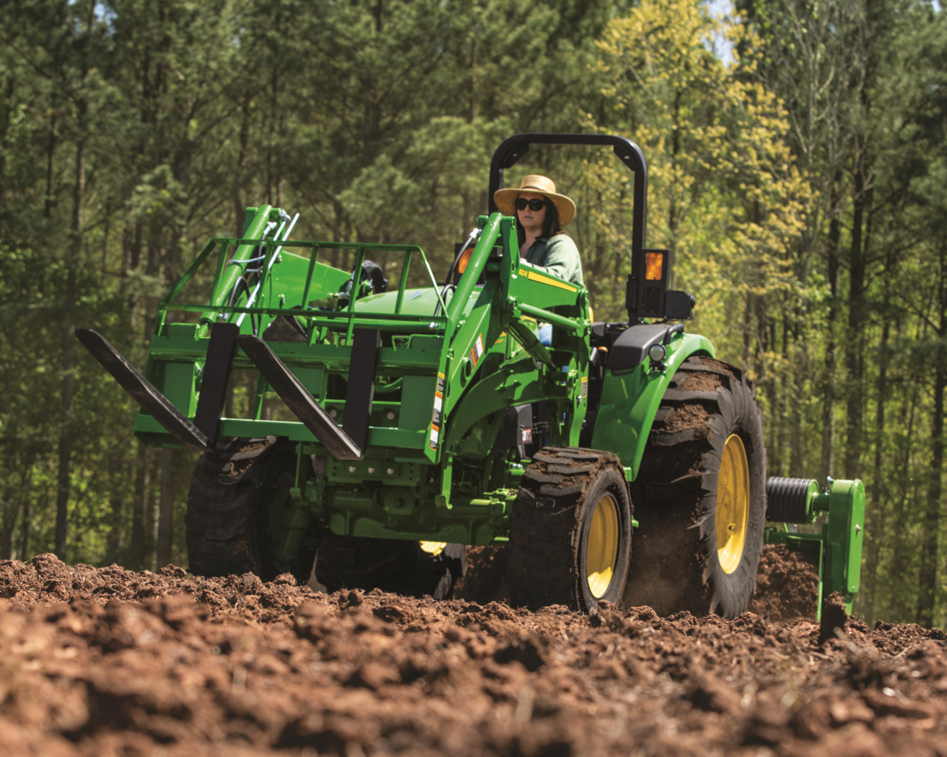 A farmer prepares the soil for fall food plot planting.