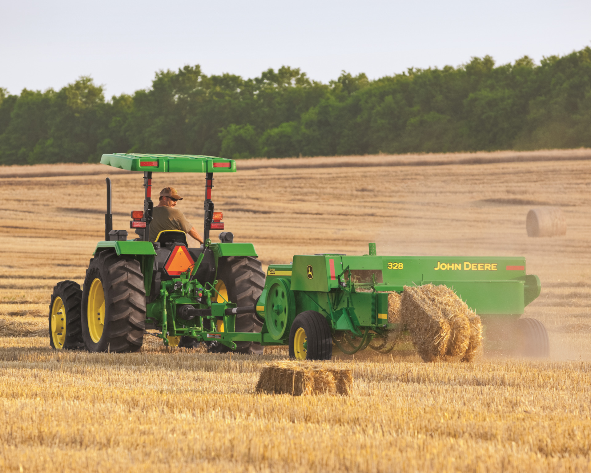 A hay baler gathers hay in Texas.