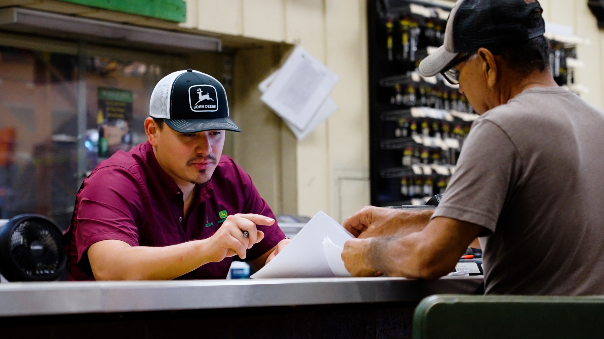 A Tellus worker speaks with a customer.