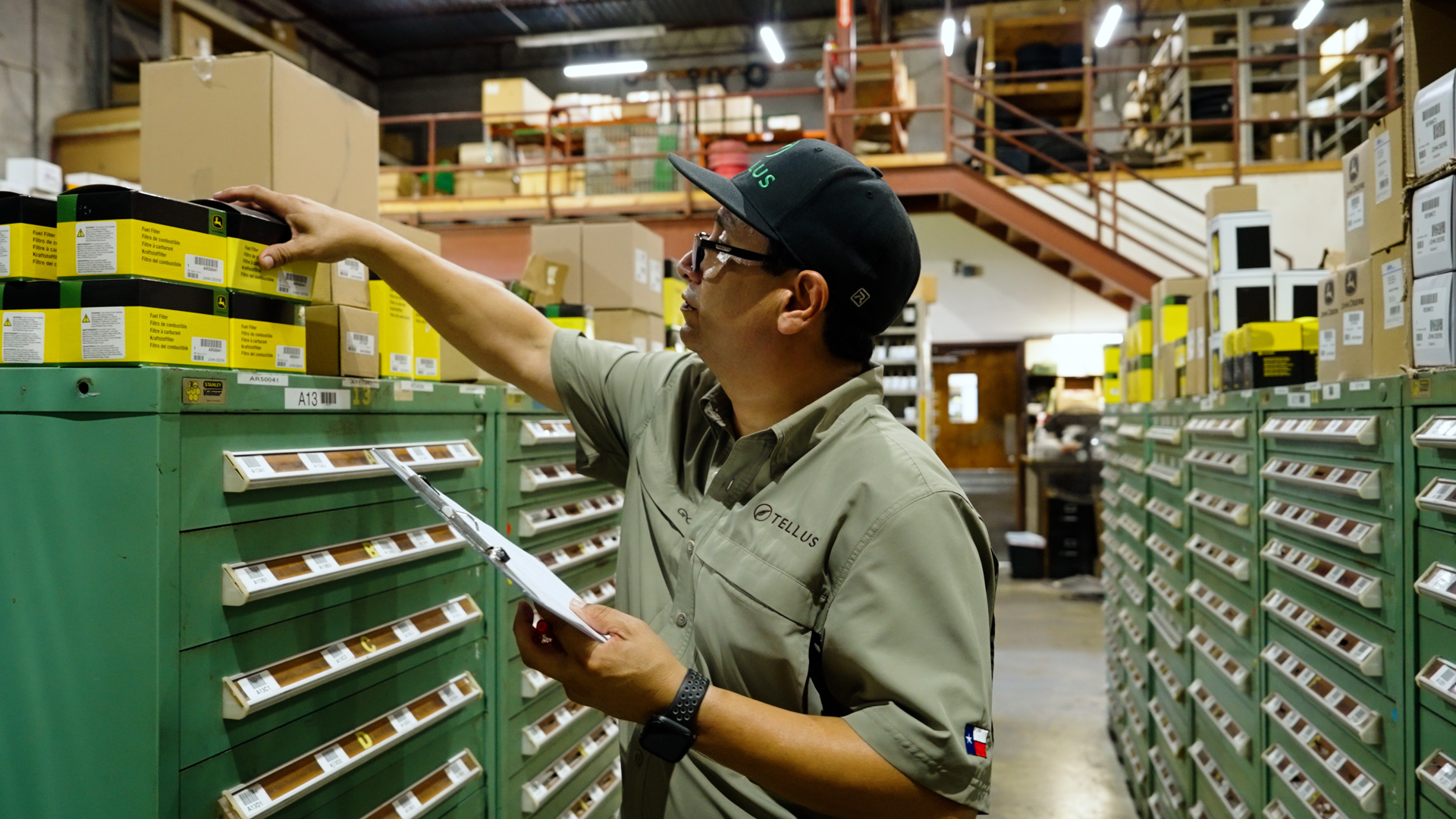 A worker in the Parts Department at Tellus searches for a part for a customer.